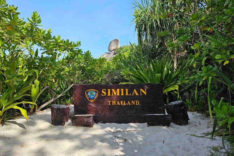 Similan island famous national park sign on beach island number 9 near sail rock viewpoint