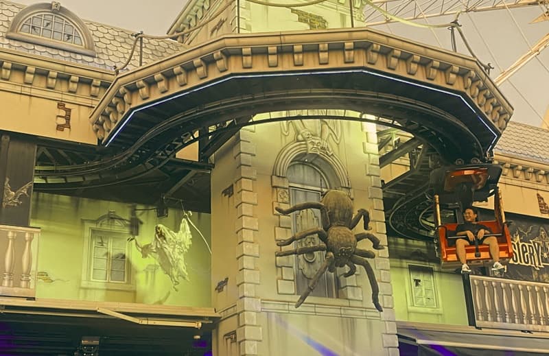 tourist rides the ghost train at the asiatique waterfront market