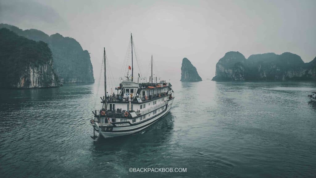 a tradidioanl junk boat operating a ha long bay boat cruise