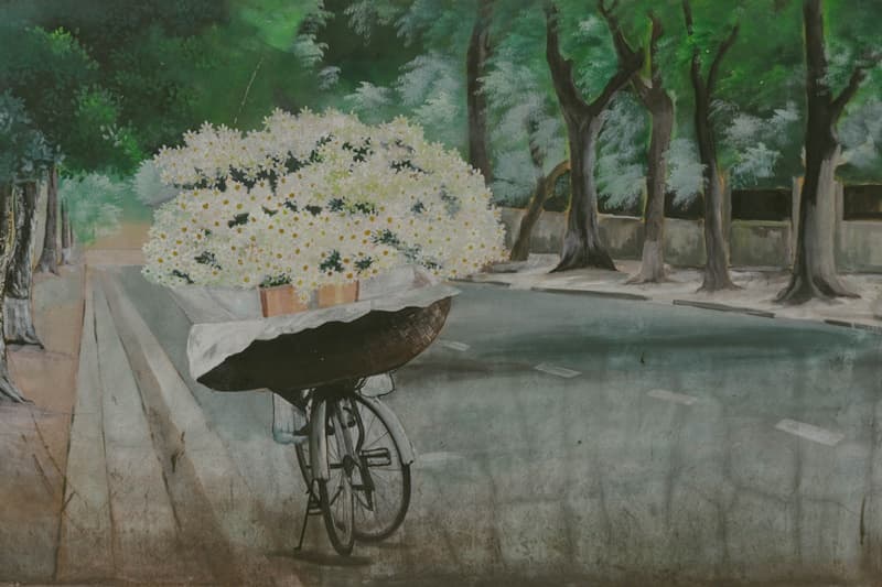 street ir painting in hanoi on the wall near old quarters