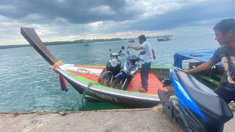 Loading Motorcyles onto the boat on Koh Libong