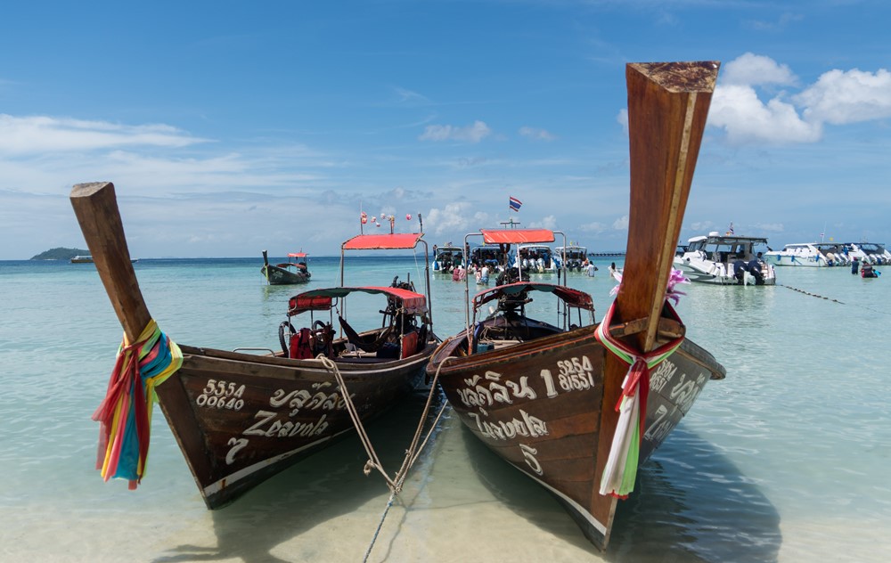 thai longtail boats beach koh phi phi island thailand