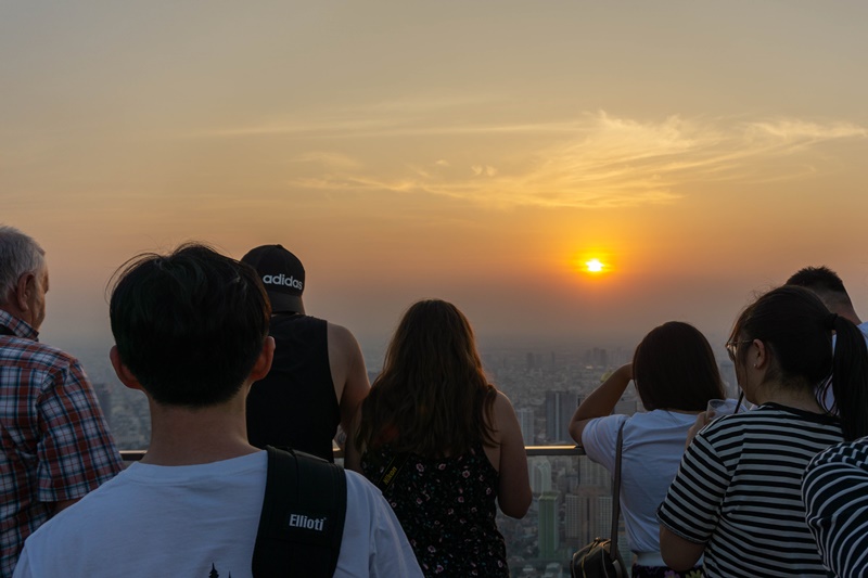 tourists taking photos of the best bangkok sunset