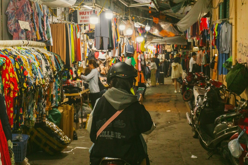 hanoi in vietnam things to do go to the market a motorcycle passes through the hanoi night market