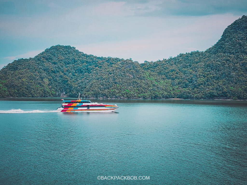 Boat registered with the name Langkawi Ferry 1 carries tourists on the sea crossing from Kuala Perlis in Mainland Malaysia to Kuah Harbor on Langkawi Island