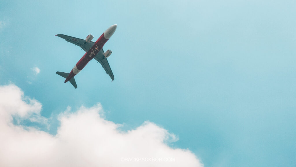 AirAsia airplane is taking off from getting to Langkawi Airport 