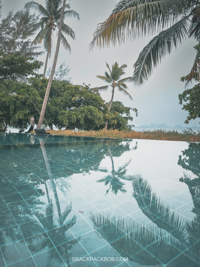 Swimming Pool and Palm trees at Pawapi Beach Resort in Koh Mook