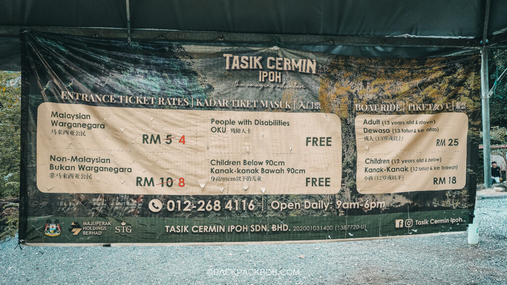 A sign in Ipoh, Malaysia lists the prices and entrance fees for things to do in Ipoh, including the cost to enter Tasik Cermin, Mirror Lake