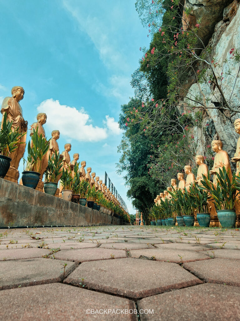 the sam pong temple on our Malaysia itinerary you can see the gold statues