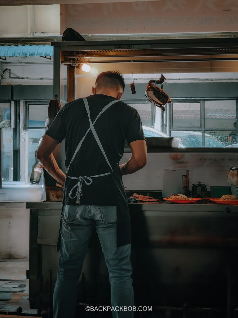 A Malaysian Chef cooks famous Ipoh chicken bean sprouts Nga Choi Kai