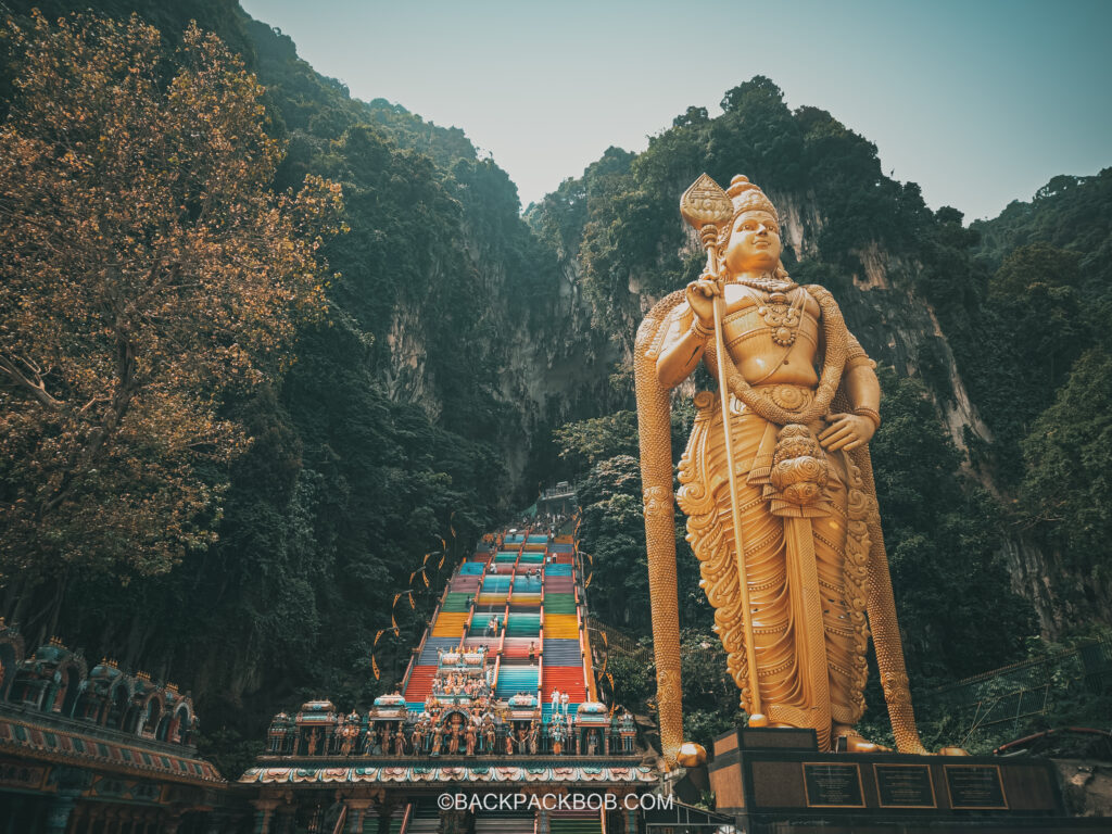 Photo shows the Hindu God Lord Murigan outise the Batu Caves which is the most popular free thing to do in Kuala Lumpur