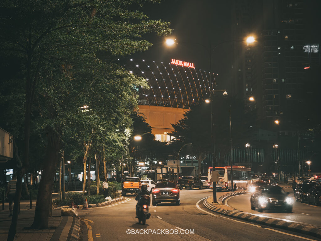 A street in the evening in Kuala Lumpur the Jakel Mall is in the background