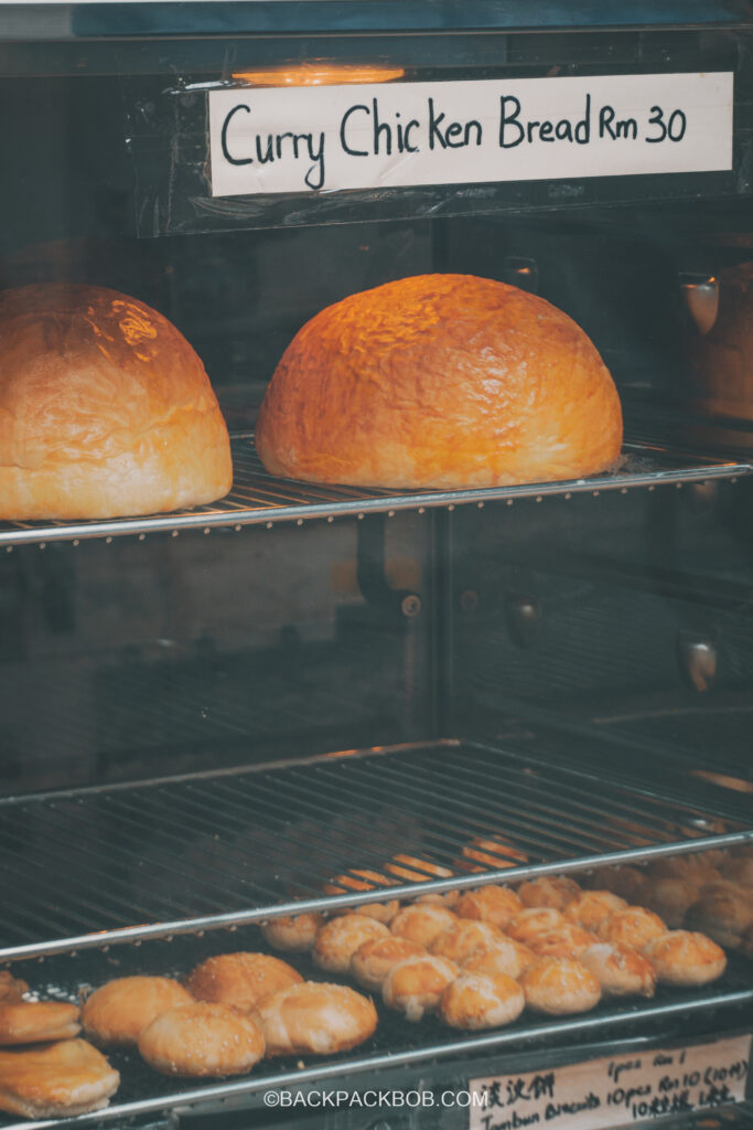 An XL Xtra-Large Curry Chicken Bun is seen in a cabinet for sale at the Jonkers Market Jonkers Street Market | Jonkers Street Weekend Market | Jonkers Street Night Market | Jonkers Street Market in Melaka