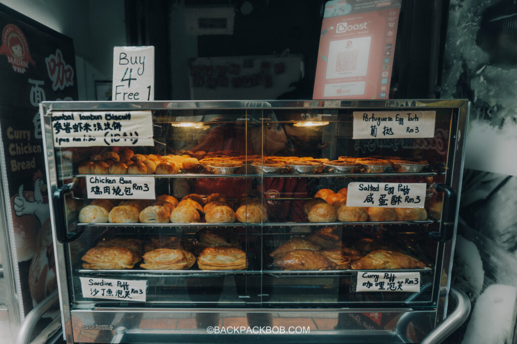 A store selling baked good like curry puffs, egg tarts and chicken buns on Jonker Street in malaysia Jonkers Street Market | Jonkers Street Weekend Market | Jonkers Street Night Market | Jonkers Street Market in Melaka