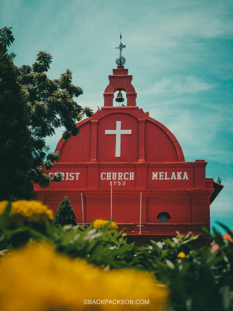 taking a photo of the christ church melaka on this Malaysia itinerary