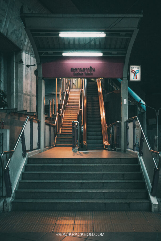 Entrance to Saphan Taksin BTS Station before sunrise Bangkok Skytrain