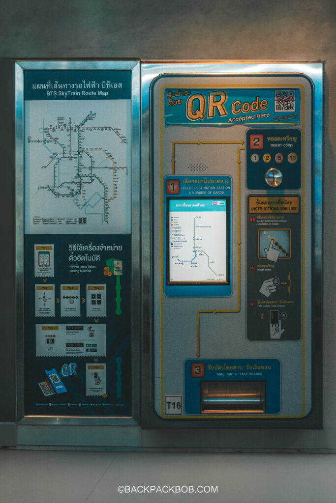 An old style coin machine at the BTS Station where you can buy tickets for the BTS Skytrain