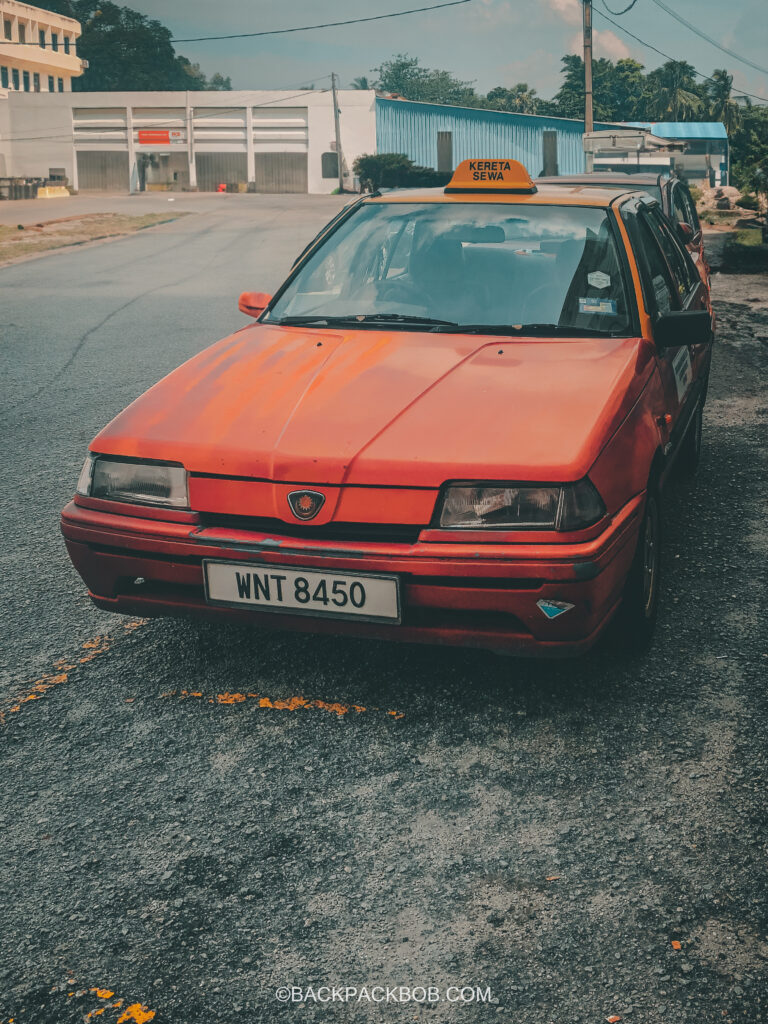 A red taxi parked in Ipoh