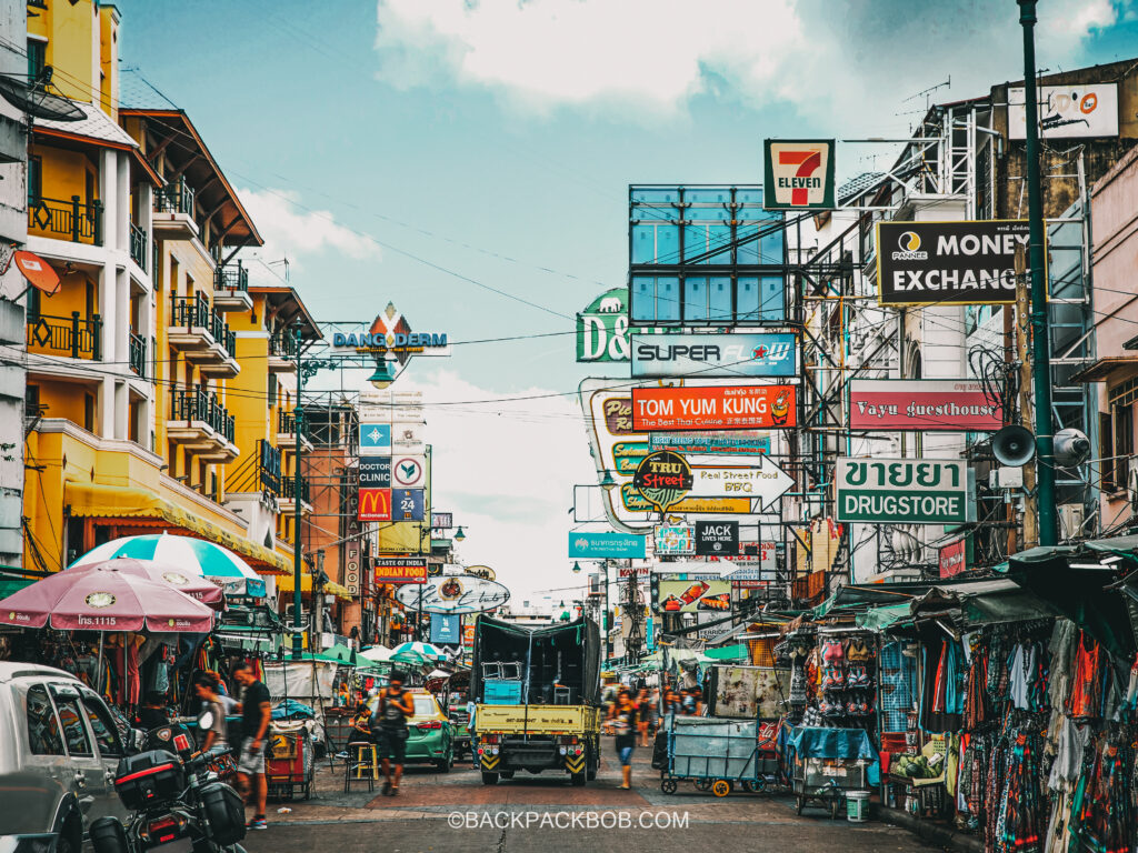 Khao San Road in Bangkok. The D&D Inn Sign shows where to Stay in Bangkok.