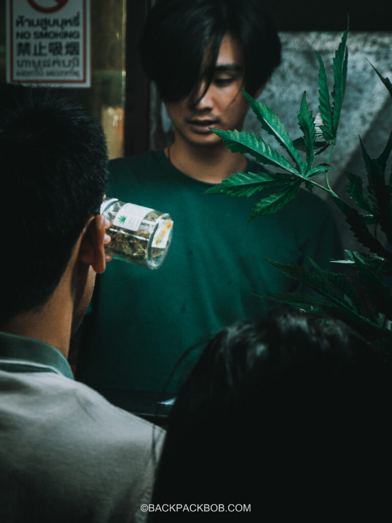 A Thai cannabis sellers is showing customers the different cannabis products he has for sale at his legal cannabis stall in the beach town on Koh Phi Phi Island in Thailand when cannabis is legal