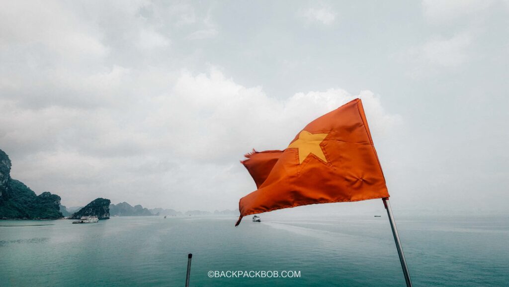 Vietnam Flag Sailing on Ha Long Bay Boat Cruise Boat