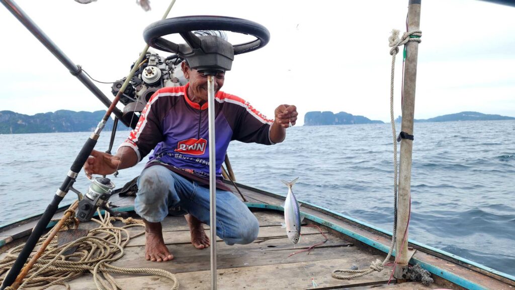 longtail boat fishing fisherman koh phi phi thailand